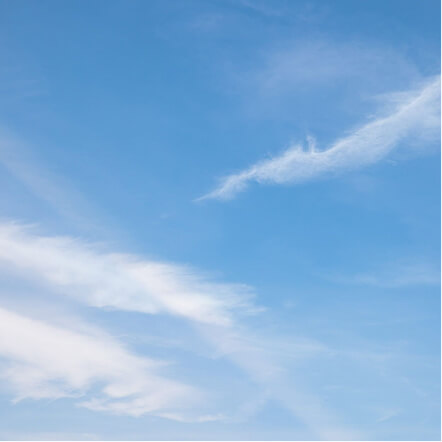 Clear window glass with an unobstructed sky view.