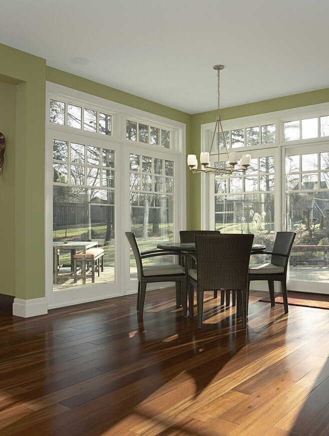 Custom casement windows with matching transom arrays in a residential dining room.