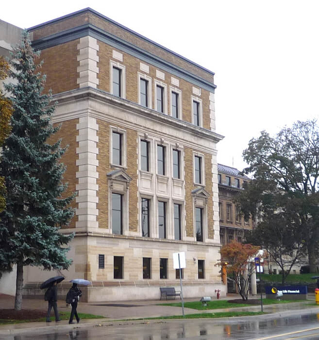 Custom multi-pane commercial architectural windows on a historic facade.